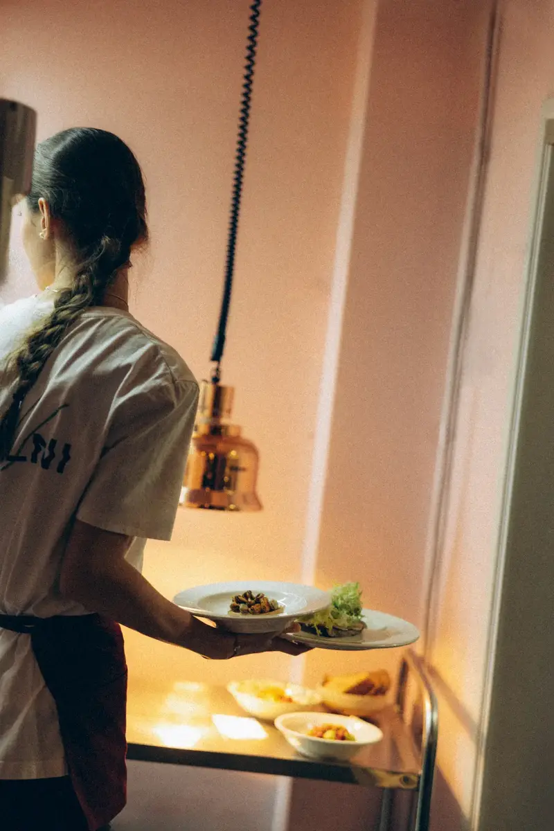 Service at Pijalni kitchen — plates leaving the pass